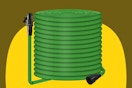 A green 50-foot garden hose is coiled. On each end is a standard 3/4 inch connector.