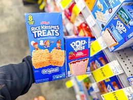 hand holding rice krispies and poptarts in cvs