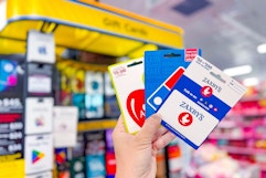 hand holding gift cards