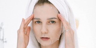 A woman wearing a sheet mask