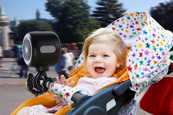 a baby with a stroller fan