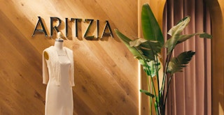 An Aritzia store sign and mannequin