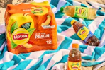 Lipton peach iced tea on a beach towel