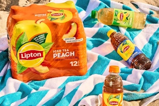 Lipton peach iced tea on a beach towel