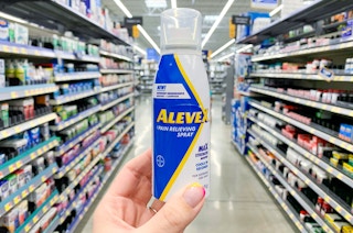alevex pain relieving spray held in center of walmart aisle