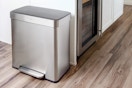 Lifestyle image of the Qualiazero Kitchen Trash Can in kitchen setting