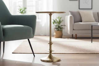 gold metal side table in a living room
