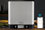 food scale being displayed next to phone app