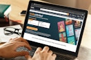 someone looking at the kindle unlimited webpage on amazon