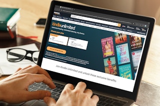 someone looking at the kindle unlimited webpage on amazon