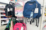 jansport backpacks on a store shelf