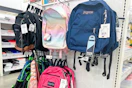 jansport backpacks on a store shelf