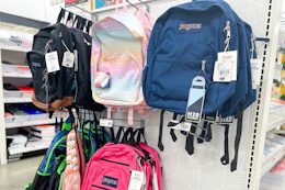 jansport backpacks on a store shelf