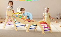 kid playing on a climbing set 