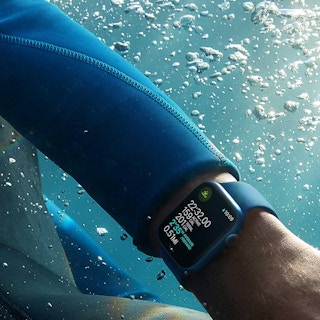 person wearing an apple watch underwater