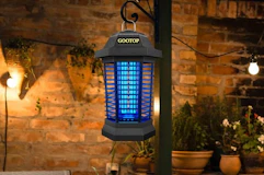 a bug zapper on a post outside 