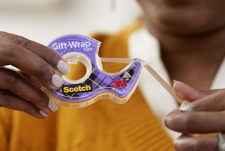 woman holding scotch tape