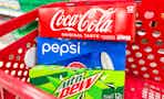 3 soda 12-packs sitting in a target cart