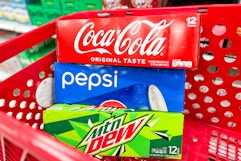 3 soda 12-packs sitting in a target cart