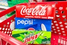 3 soda 12-packs sitting in a target cart