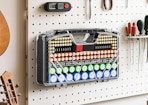 a battery organizer case on a pegboard