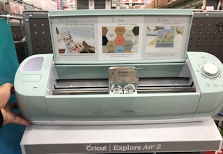 A mint Cricut Explore Air 2 in a store aisle.