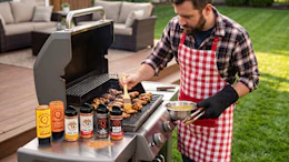 a person grilling on a grill outside