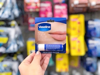 hand holding vaseline lip therapy at dollar tree