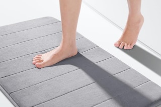 a woman using a bath mat
