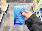 hand holding gillette clinical deodorant 