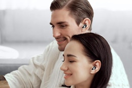 a man and woman wearing earbuds
