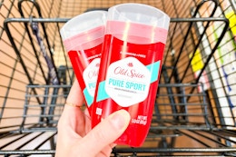 hand holding old spice deodorant sticks