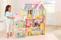 Lifestyle image of the KidKraft Lola Mansion Wooden Dollhouse