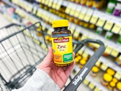 hand holding nature made zinc in walgreens