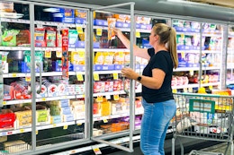 a woman shopping in a kroger grocery store 
