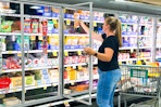 a woman shopping in a kroger grocery store