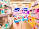 Two Ocean Spray Drink Mix 10-counts held up in center aisle at Walmart
