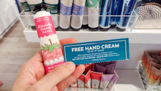 hand holding hand cream with coupon