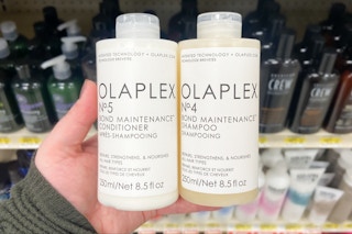 hand holding olaplex shampoo and conditioner