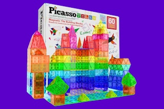 A box of 60 Picasso Tiles magnetic building blocks with a scene built from tiles in front of it