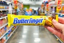hand holding a butterfinger candy bar