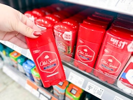 hand holding an Old Spice deodorant stick