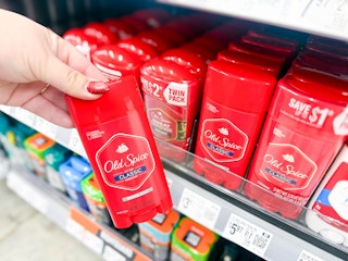 hand holding an Old Spice deodorant stick