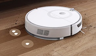 white robot vacuum on a hard wood surface