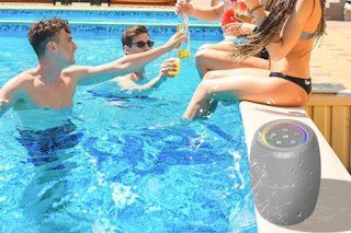 a speaker by a pool