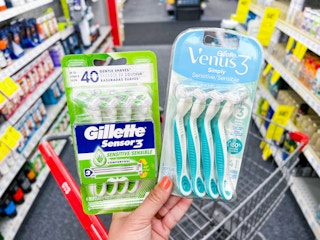 hand holding gillette & venus disposable razors