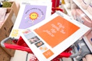 2 wall art poster print sets sitting on a target cart