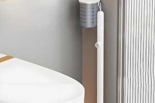 toilet wand set by a toilet