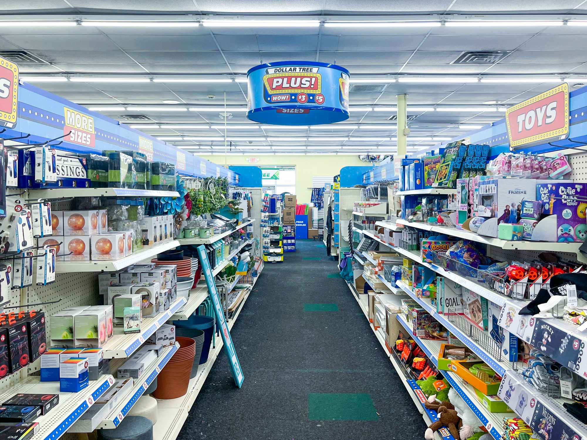 An aisle of Dollar Tree Plus priced items in Dollar Tree