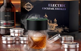 a whiskey smoker kit on a glass of whiskey 
